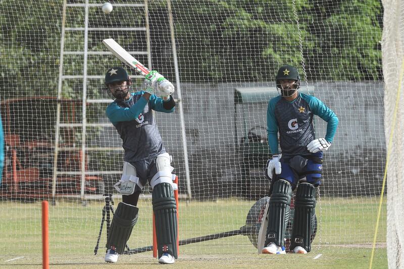 Pakistan captain Babar Azam bats as teammate Abdullah Shafique watches during a practice session in Lahore. AFP