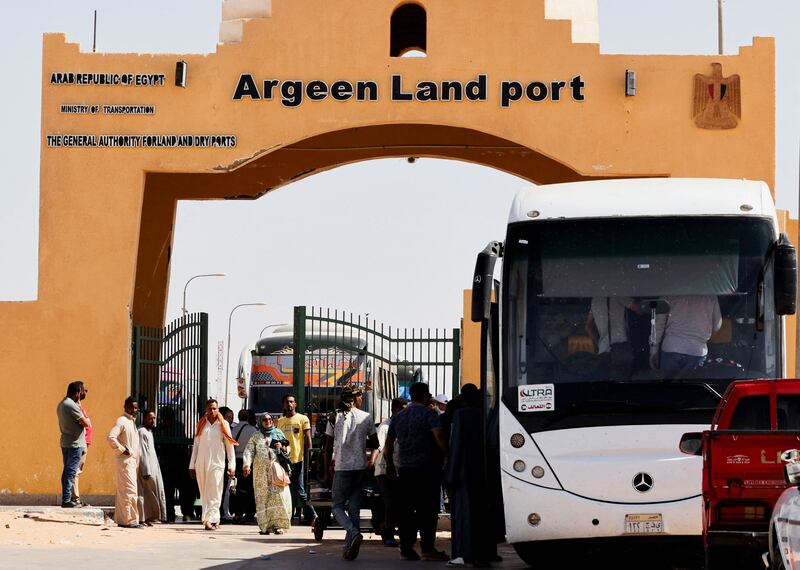 Passengers fleeing from Sudan arrive at the Argeen land port, after being evacuated from Khartoum to Abu Simbel city, on the upper reaches of the Nile, in Aswan. Reuters