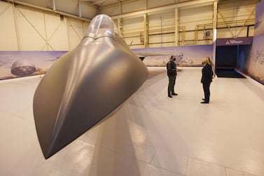 Boris Johnson tours the Team Tempest facility, which is developing future air concepts, during a visit to BAE Systems at Warton Aerodrome in Preston, northwest England, on the day a defence review is published. AFP