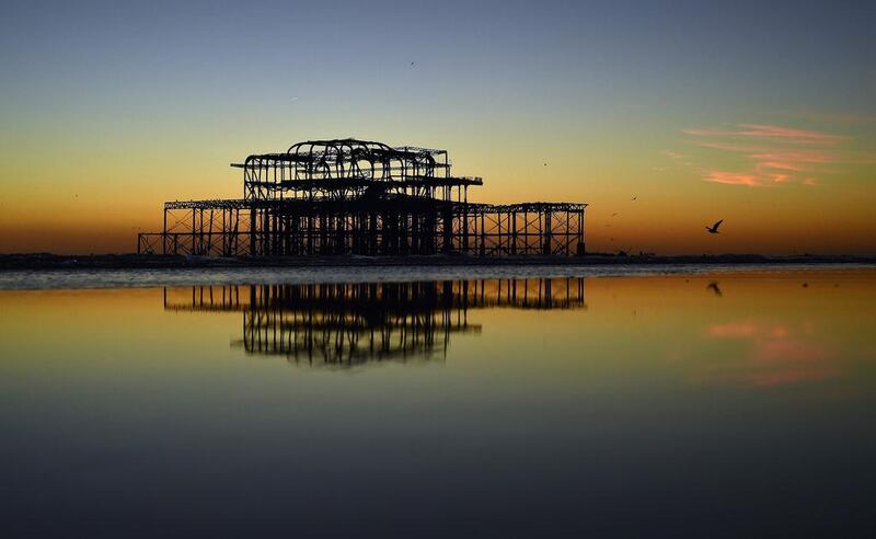 A mumeration of starlings flock to the remains of Brighton’s west pier. Glyn Kirk / AFP Photo