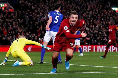 Liverpool's Xherdan Shaqiri celebrates scoring against Everton. Reuters