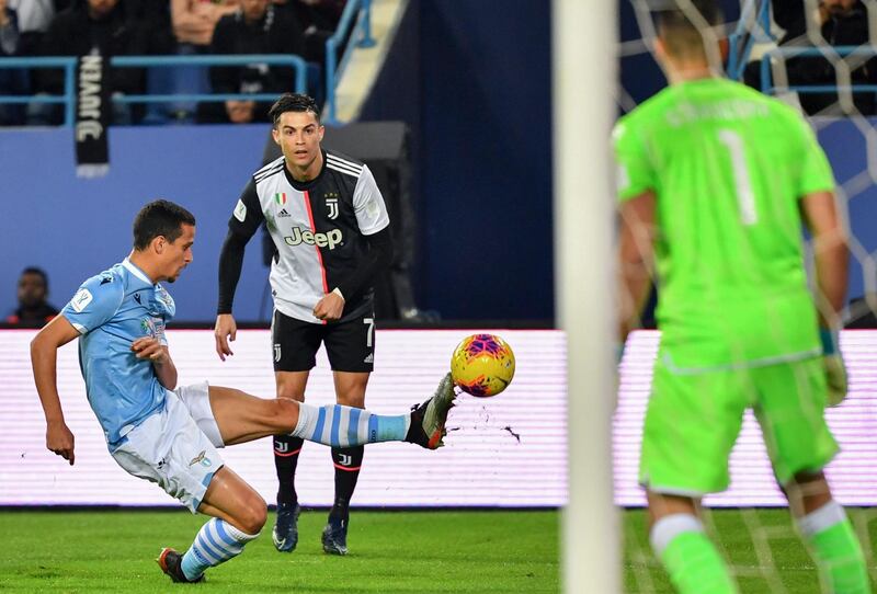 Juventus' Portuguese forward Cristiano Ronaldo (C) is marked by Lazio's Brazilian defender Luiz Felipe. AFP