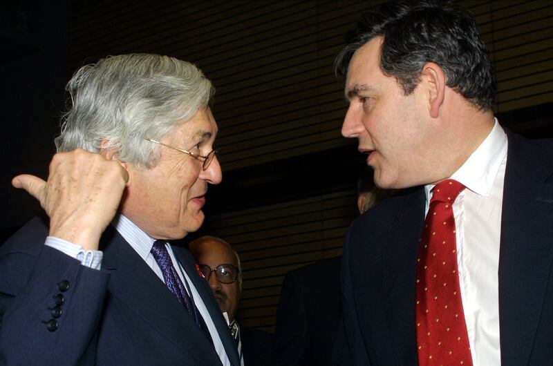 Wolfensohn speaks to former UK chancellor Gordon Brown in April 2001 during the annual spring meetings of the World Bank and the International Monetary Fund in Washington. Getty Images