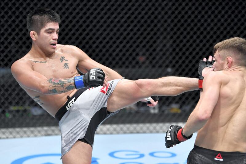 ABU DHABI, UNITED ARAB EMIRATES - JULY 26: (L-R) John Castaneda kicks Nathaniel Wood of England in their bantamweight fight during the UFC Fight Night event inside Flash Forum on UFC Fight Island on July 26, 2020 in Yas Island, Abu Dhabi, United Arab Emirates. (Photo by Jeff Bottari/Zuffa LLC via Getty Images) *** Local Caption *** ABU DHABI, UNITED ARAB EMIRATES - JULY 26: (L-R) John Castaneda kicks Nathaniel Wood of England in their bantamweight fight during the UFC Fight Night event inside Flash Forum on UFC Fight Island on July 26, 2020 in Yas Island, Abu Dhabi, United Arab Emirates. (Photo by Jeff Bottari/Zuffa LLC via Getty Images)