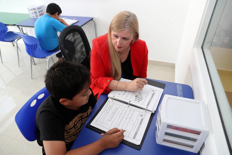 Dubai, United Arab Emirates - April 4th, 2018: Joanna Lynch, Center Director of The Tutoring Centre with Mikayeel 11 for a Money & Me feature. Wednesday, April 4th, 2018 at Sustainable City, Dubai. Chris Whiteoak / The National