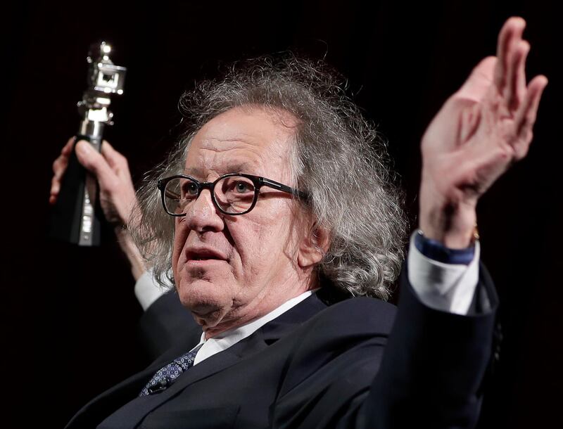 FILE - In this Feb. 11, 2017 file photo, Australian actor Geoffrey Rush poses with his 'Berlinale Camera Award' wich he received prior to the screening of the film 'Final Portrait' at the 2017 Berlinale Film Festival in Berlin, Germany. The Sydney Theatre Company says it received a complaint of â€œinappropriate behaviorâ€ against Rush, an allegation lawyers for the Oscar winner denied. The company wasnâ€™t disclosing details of the behavior alleged to have occurred while the 66-year-old Australian actor was an employee. Media reports say the allegation dated from the theaterâ€™s production of â€œKing Lear,â€ about two years ago. His lawyers deny Rush was involved in inappropriate behavior. (AP Photo/Michael Sohn, File)