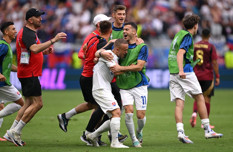 Slovakia players celebrate after the match. Getty Images