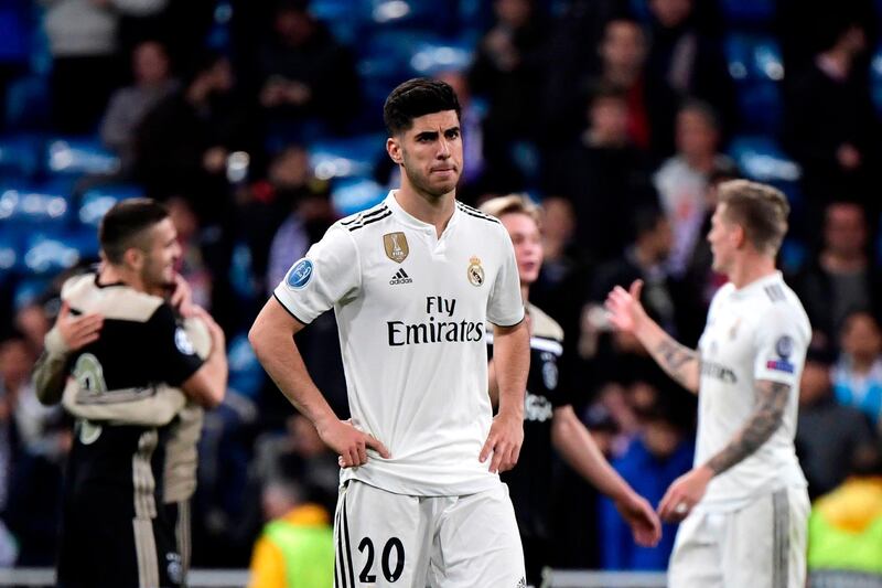 Real Madrid's Spanish midfielder Marco Asensio looks dejected. AFP