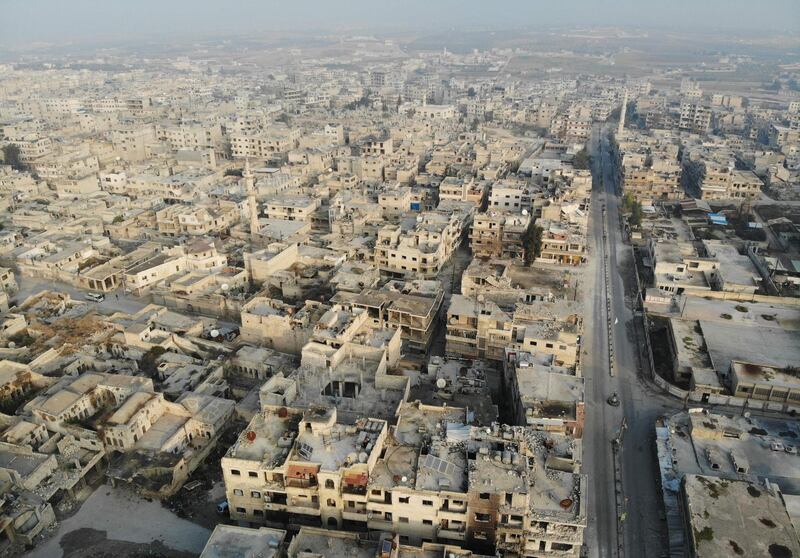 A drone picture shows empty streets and damaged buildings in the town of Maaret Al-Numan in the northwestern Idlib province.  AFP