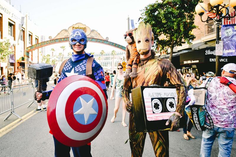 Cosplayers are dressed as Captain America and Groot. AFP