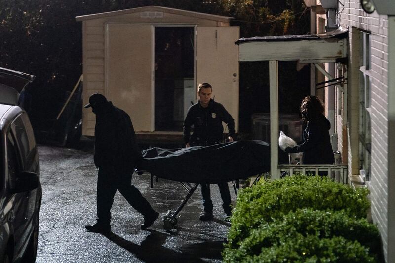 People with the medical examiner's office wheel out a body on a stretcher from a massage parlor where three people were shot and killed in Atlanta, Georgia. Eight people were killed in shootings at three different spas in the US state of Georgia on March 16 and a 21-year-old male suspect was in custody, police and local media reported, though it was unclear if the attacks were related. AFP