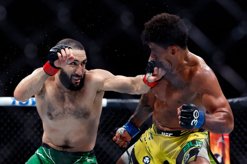 Belal Muhammad lands a punch on Gilbert Burns during their welterweight bout at UFC 288. AFP