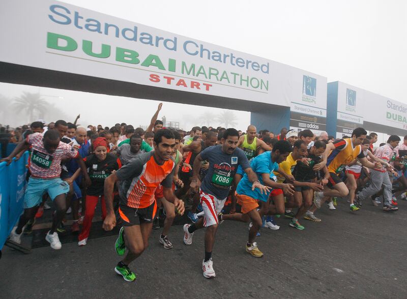 Dubai, United Arab Emirates, Jan 25 2013, 2013 Standard Chartered Dubai Marathon, 10K Run- Runners in the 10K run sprint off the starting line in the Standard Chartered Dubai Marathon, Jan 25, 2013.  Mike Young / The National

