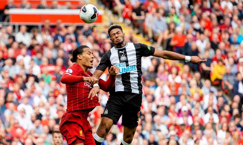 Liverpool's Virgil van Dijk in action with Newcastle's Joelinton. EPA