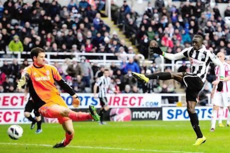 Papiss Cisse, right, hits Newcastle's winner past Stoke goalkeeper Asmir Begovic. Stu Forster / Getty Images