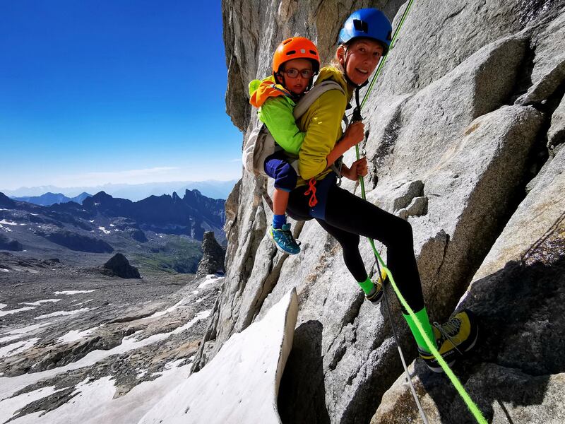 **Sent under embargo, no use before 14.00pm BST August 3 2020**
Jessica and Jackson Houlding on a three day trip to climb Piz Badile. See SWNS story SWPLclimb; A toddler and his seven-year-old sister have smashed records to become the youngest mountain climbers to scale a massive 10,000ft peak and were given a reward - of Haribo. Freya Houlding, seven, and three-year-old Jackson were literally following in their professional climber father's footsteps as he led them up Piz Badile on the border of Switzerland and Italy. Dad Leo Houlding, 40, spends his working life climbing some of the most dangerous and most remote mountains on earth, and his wife, 41-year-old Jessica, a GP, is an avid climber too. And now Freya has become the youngest person to climb the mountain unaided, and Jackson the youngest person to get to the top - 153 years to the day since the peak was first climbed. Jackon says he enjoyed his climb - and the sweets he got as a well done.