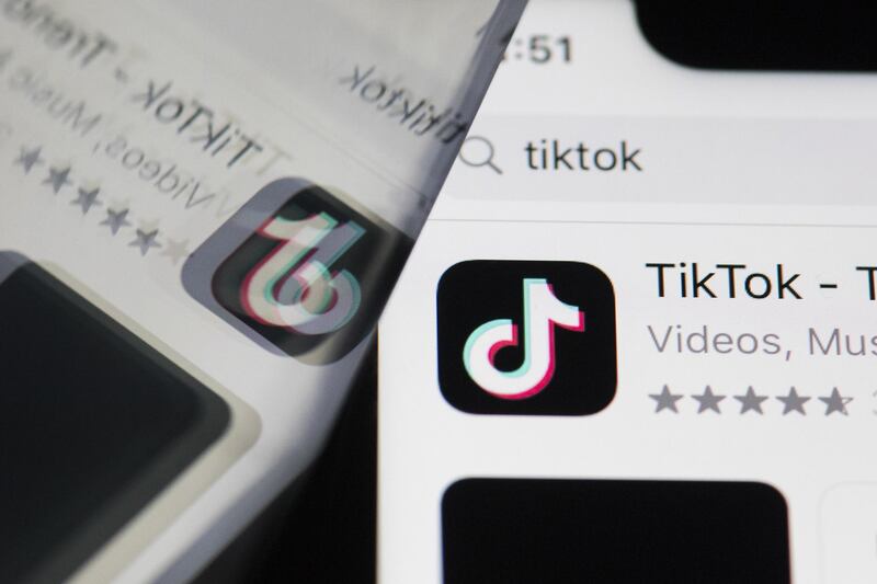 The download page for ByteDance Ltd.'s TikTok app is arranged for a photograph on a smartphone in Sydney, New South Wales, Australia, on Monday, Sept. 14, 2020. Oracle Corp. is the winning bidder for a deal with TikTok’s U.S. operations, people familiar with the talks said, after main rival Microsoft Corp. announced its offer for the video app was rejected. Photographer: Brent Lewin/Bloomberg