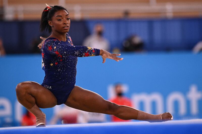 In this file photo taken on July 25, 2021 USA's Simone Biles competes in the floor event of the artistic gymnastic women's qualification during the Tokyo 2020 Olympic Games.
