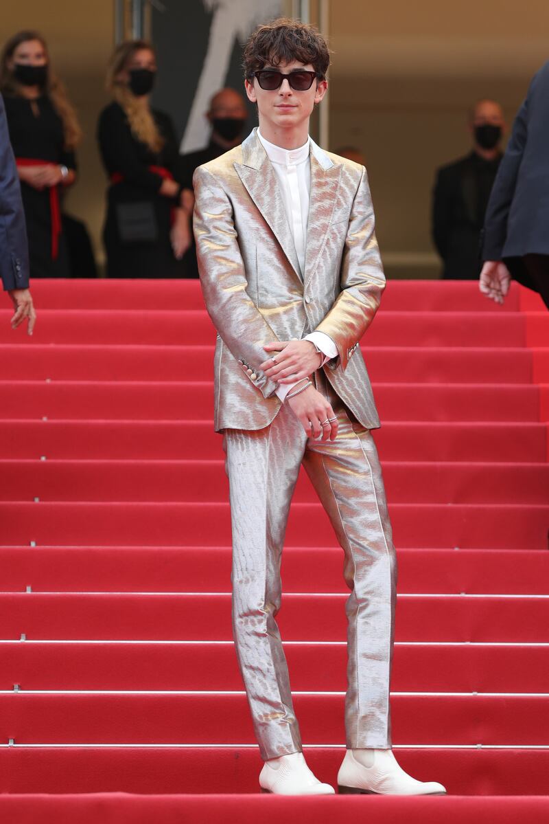 In a shiny silver Tom Ford suit at 'The French Dispatch' screening during the 74th annual Cannes Film Festival in July 2021. Getty Images