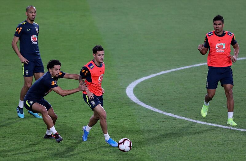 Brazil's Philippe Coutinho with the ball during training. AP