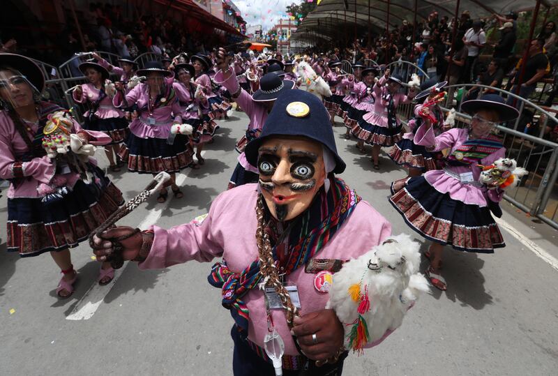 Groups of people perform the dance of the Llamerada, during the beginning of the Carnival in Oruro, Bolivia, 26 February 2022.  The Oruro Carnival, the main one in Bolivia, returns after a pause due to the COVID-19 pandemic.   EPA / MARTIN ALIPAZ