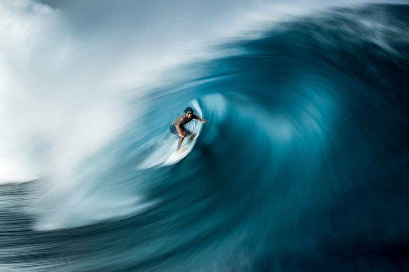 Winner of Ocean Adventure Photographer of the Year, Ben Thouard: Surfer Matahi Drollet catches a wave known as Teahupo’o in Tahiti, French Polynesia
