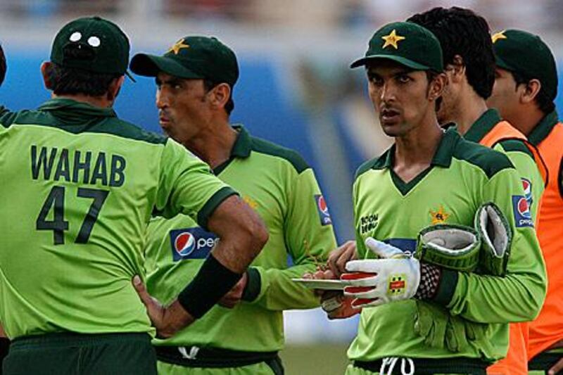 Zulqarnain Haider, right, eyes the camera during a drinks break in the third one-day match against South Africa in Dubai.