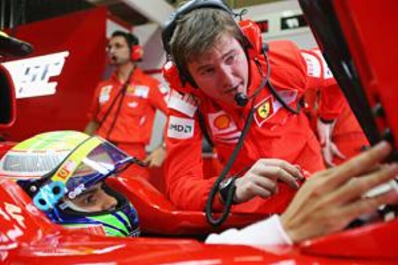 Rob Smedley, right, consults with Ferrari driver Felipe Massa during the dramatic final weekend of the 2008 Formula One season in Brazil.