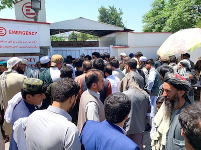 Crowds of family members of victims wait outside the Emergency Hospital waiting anxiously for news of their loved ones injured in the Taliban attack on Monday morning. Photo by Hikmat Noori for The National