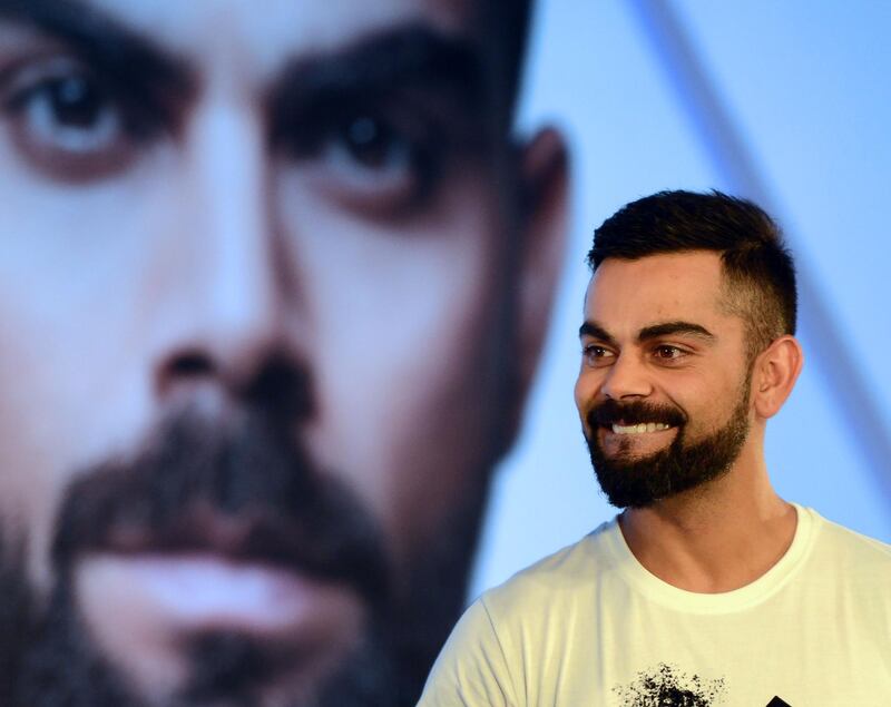 Indian cricketer Virat Kohli attends a promotional event for a watch company in Mumbai on September 26, 2018. / AFP / PUNIT PARANJPE
