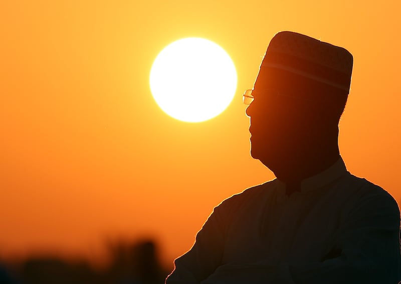A man prays at dawn on the first day of Eid. Chris Whiteoak / The National