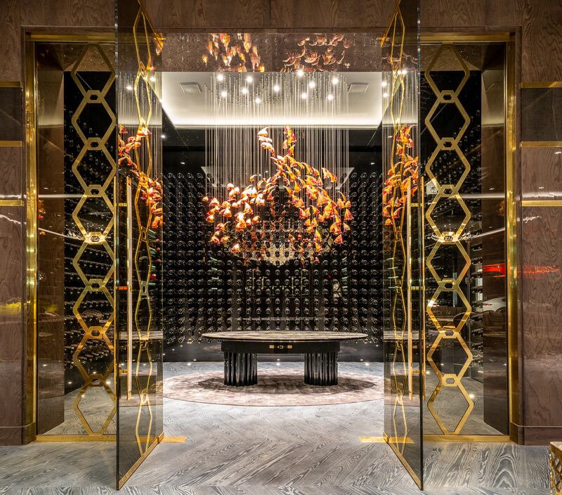 The custom Murano glass art installation inside the private wine room.