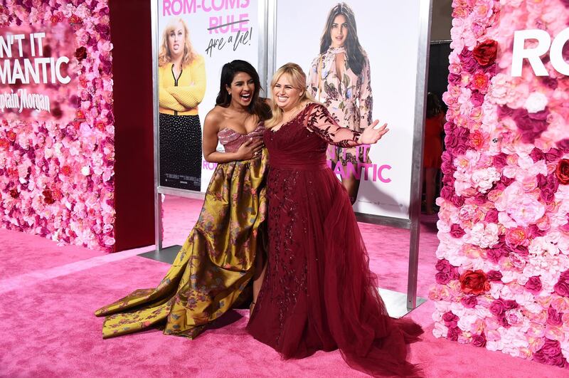 Priyanka Chopra and Rebel Wilson joke on the pink carpet at the LA Premiere. AP