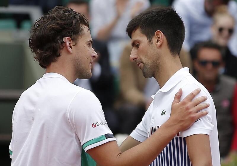 Novak Djokovic, right, has suffered a meteoric fall since his French Open title win last year. Ian Langsdon / EPA