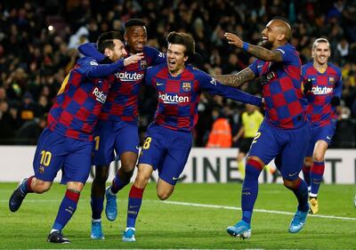 epa08142323 FC Barcelona's Lionel Messi (L) celebrates with teammates after scoring a goal during the Spanish LaLiga soccer match between FC Barcelona and Granada CF at the Camp Nou stadium in Barcelona, Catalonia, Spain, 19 January 2020.  EPA/ENRIC FONTCUBERTA