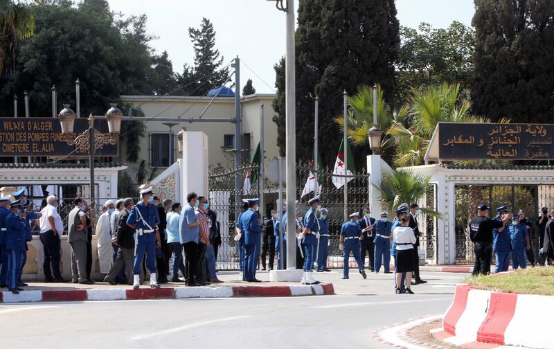 Police members stand outside El Alia cemetery, where late former Algerian President Abdelaziz Bouteflika will be buried, in Algiers, Algeria.  REUTERS