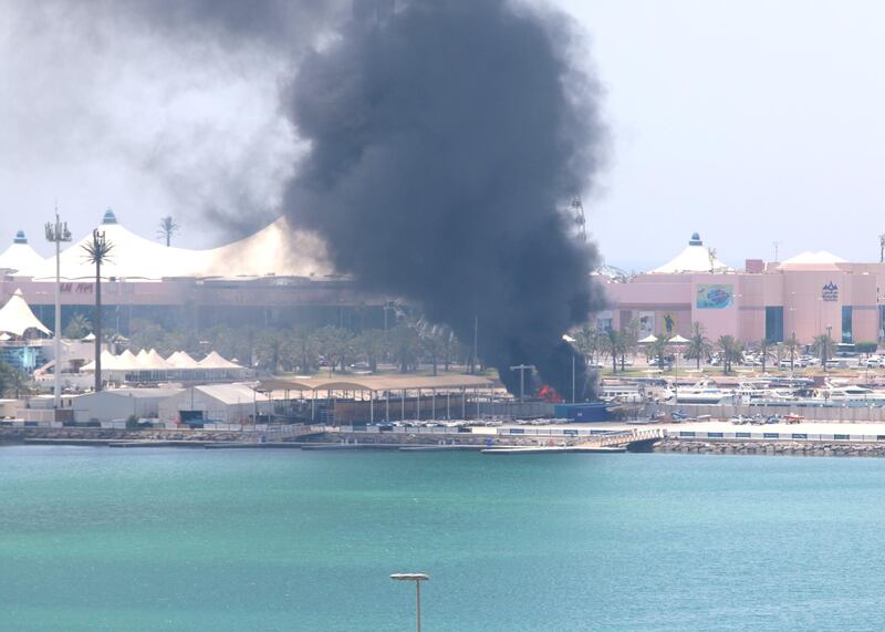 A docked boat catches fire in the marina near Abu Dhabi's breakwater. Courtesy: Michael Grotzke