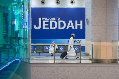 A handout picture provided by the Saudi Ministry of Hajj and Umra on July 25, 2020, shows a traveller walking with his luggage as part of the first group of arrivals for the annual Hajj pilgrimage, at the Red Sea coastal city of Jeddah's King Abdulaziz International Airport. === RESTRICTED TO EDITORIAL USE - MANDATORY CREDIT "AFP PHOTO / HO / MINISTRY OF HAJJ AND UMRA" - NO MARKETING NO ADVERTISING CAMPAIGNS - DISTRIBUTED AS A SERVICE TO CLIENTS ===
 / AFP / Saudi Ministry of Hajj and Umra / - / === RESTRICTED TO EDITORIAL USE - MANDATORY CREDIT "AFP PHOTO / HO / MINISTRY OF HAJJ AND UMRA" - NO MARKETING NO ADVERTISING CAMPAIGNS - DISTRIBUTED AS A SERVICE TO CLIENTS ===
