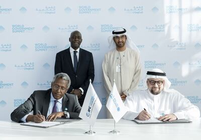 Dr Sultan Al Jaber and IFC managing director Makhtar Diop witness the signing of the agreement by Masdar chief executive Mohamed Al Ramahi and IFC vice president Mohamed Gouled on February 14. Photo: Abu Dhabi Media Office
