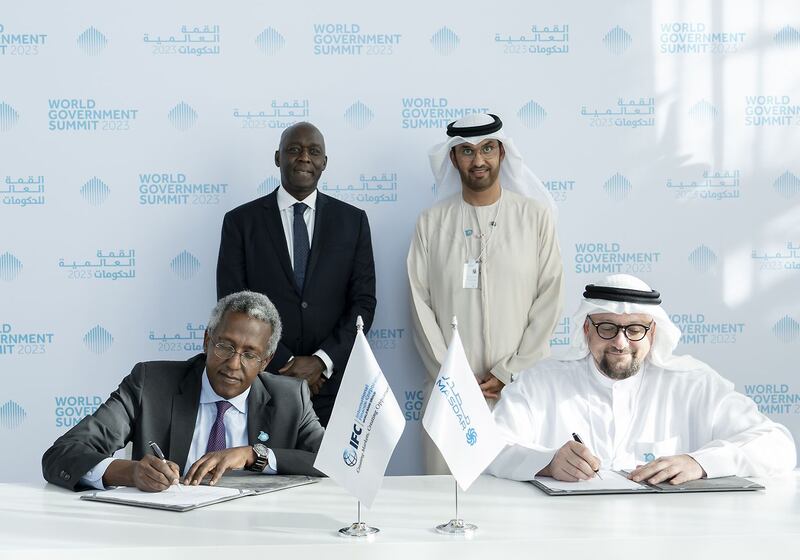 Dr Sultan Al Jaber and IFC managing director Makhtar Diop witness the signing of the agreement by Masdar chief executive Mohamed Al Ramahi and IFC vice president Mohamed Gouled. Photo: Abu Dhabi Media Office
