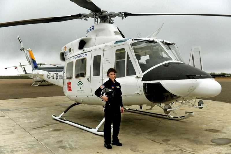 To mark the occasion of International Women's Day on March 8, 2018 AFP presents a series of 45 photos depicting women performing roles or working in professions more traditionally held by men.  More images can be found in www.afpforum.com  Search SLUG  "WOMEN-DAY -PACKAGE". 
Carla Rozalen, 29 years old, helicopter pilot poses for a picture in front of a Bell 412 twin-engine utility helicopter at the FAASA Group, in Palma del Rio, Cordoba on February 27, 2018.


In the ring, battling flames or lifting off into space, women have entered professions generally considered as men's jobs. For International Women's Day, AFP met with women breaking down the barriers of gender-bias in the work world. / AFP PHOTO / Cristina Quicler