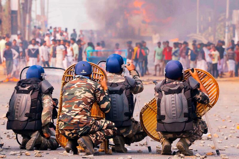 Protesters clash with police on a road during a demonstration against the Indian government's Citizenship Amendment Bill in Howrah, on the outskirts of Kolkata, West Bengal. AFP