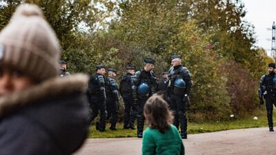 Young children surrounded by gendarme officers in full riot gear, during an eviction in Grande-Synthe, 23 October 2018. Courtesy Adrian Abbott