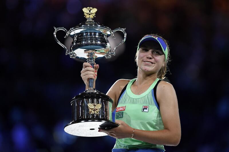Sofia Kenin of the US poses with the Daphne Akhurst Memorial Cup after winning against Spain's Garbine Muguruza in their women's singles final match on day thirteen of the Australian Open tennis tournament in Melbourne on February 1, 2020. IMAGE RESTRICTED TO EDITORIAL USE - STRICTLY NO COMMERCIAL USE
 / AFP / Saeed KHAN / IMAGE RESTRICTED TO EDITORIAL USE - STRICTLY NO COMMERCIAL USE
