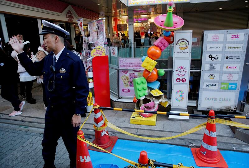 A policeman stands guard at a site where a vehicle ploughed into crowds celebrating New Year's in a popular tourist area of Harajuku in Tokyo, Japan, January 1, 2019. REUTERS/Kim Kyung-Hoon