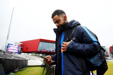 India captain Virat Kohli leaves after rain stopped play during the first 2019 Cricket World Cup semi-final at Old Trafford on Tuesday. Jason Cairnduff / Reuters
