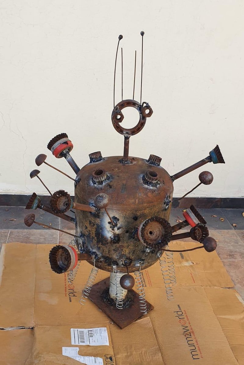 Featuring a bulbous oval body with scrapped farm tools, plumbing and bicycle parts jutting out from its iron exterior it doesn’t take much to figure out what Tariq Al Salman’s metal sculpture represents. Tariq Al Salman