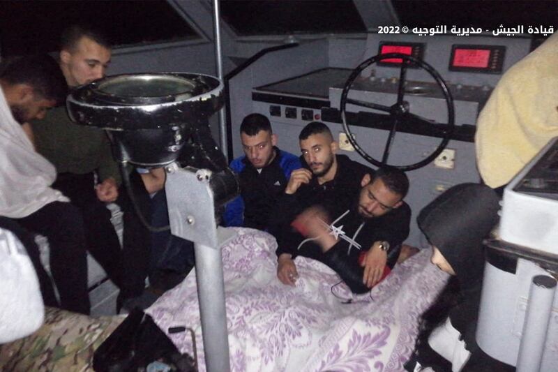 A handout photo allegedly shows survivors of a capsized boat on board a Lebanese army vessel after they were rescued off the coast of the northern Lebanese city of Tripoli.  AFP