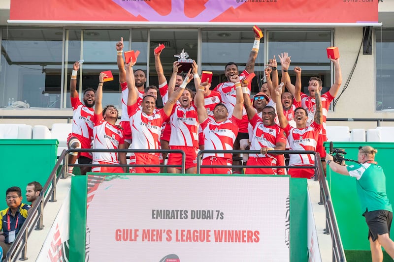 Dubai Tigers celebrate with the trophy after winning the Gulf Men’s League Finals at Dubai Sevens against Dubai Hurricanes.  All photos: Ruel Pableo for The National