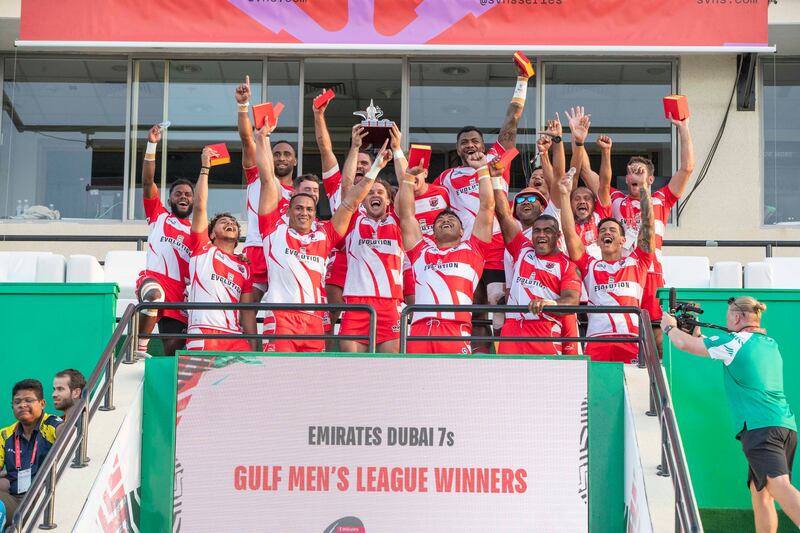 Dubai Tigers celebrate with the trophy after winning the Gulf Men’s League Finals at Dubai Sevens against Dubai Hurricanes.  All photos: Ruel Pableo for The National